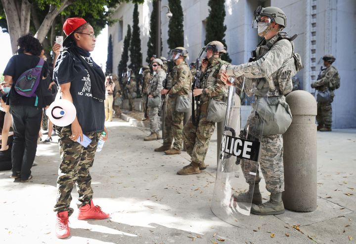 A protester looks at National Guard troops posted in Los Angeles on June 3. Jackson was among their ranks.