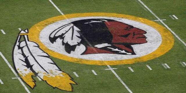 The Washington Redskins NFL football team logo is seen on the field