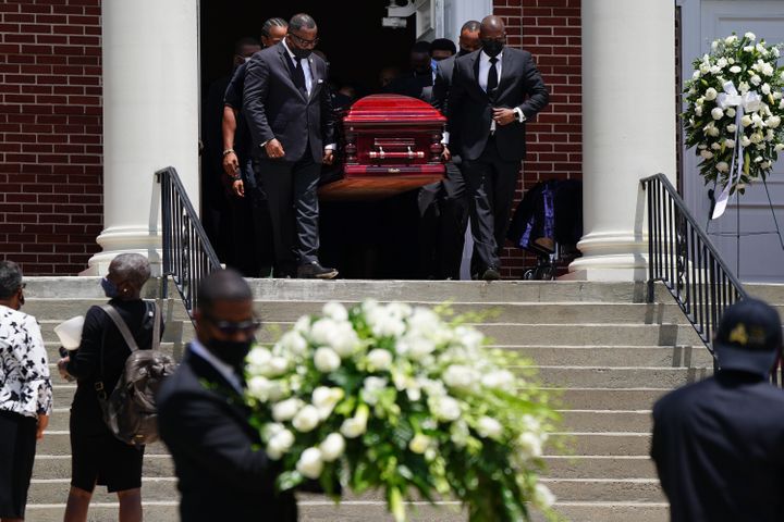 ATLANTA, GA - JULY 23: The casket holding the body of civil rights icon C.T. Vivian is carried out of Providence Missionary B
