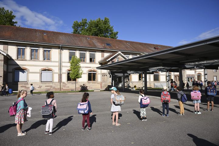 Children line up to enter their classrooms at an elementary school in Strasbourg,&nbsp; France. Primary and middle schools in the country reopened on June 22.