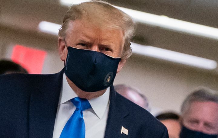 President Donald Trump finally wears a mask as he visits Walter Reed National Military Medical Center in Bethesda, Maryland, 