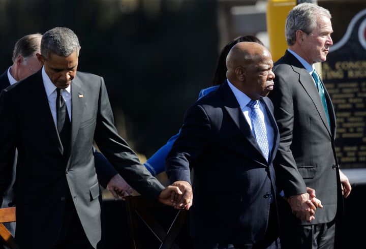 President Barack Obama, Rep. John Lewis, and former President George W. Bush hold hands on&nbsp;March 7, 2015, during a cerem