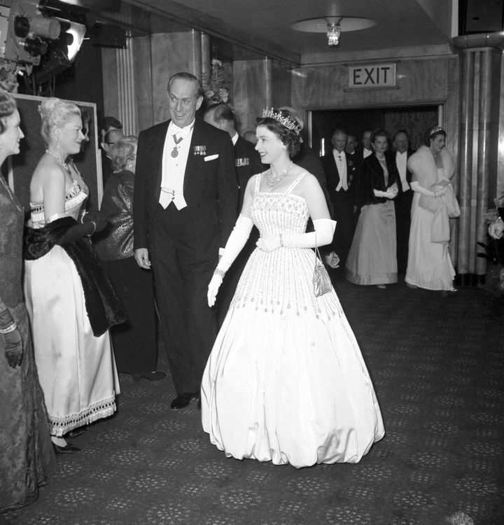 Queen Elizabeth wearing the original dress in 1962 at the premiere of "Lawrence of Arabia." Princess Beatrice wore an updated