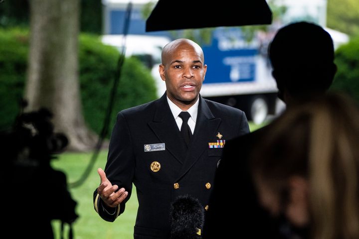 Surgeon General Jerome Adams during a TV interview at the White House on Tuesday.