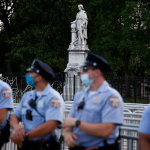 Philadelphia police officers gather near the