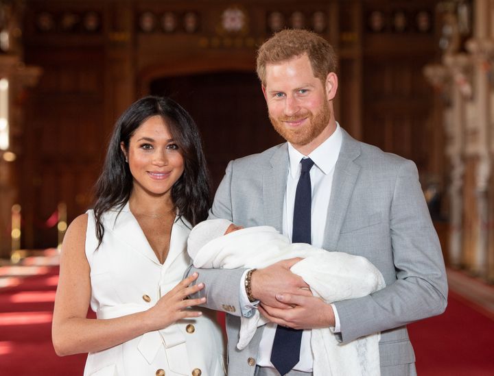 The Duke and Duchess of Sussex pose with their newborn son in St. George's Hall at Windsor Castle on May 8, 2019.