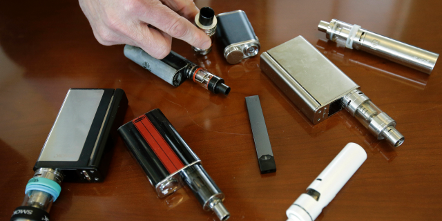 As of last year, more than 5 million youths were using e-cigs, according to the Food and Drug Administration. (AP Photo/Steven Senne)