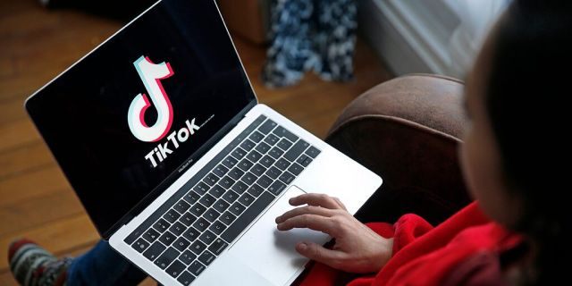 In this photo illustration the logo of Chinese media app for creating and sharing short videos TikTok, also known as Douyin is displayed on the screen of an apple macbook pro computer on November 20, 2019 in Paris, France.