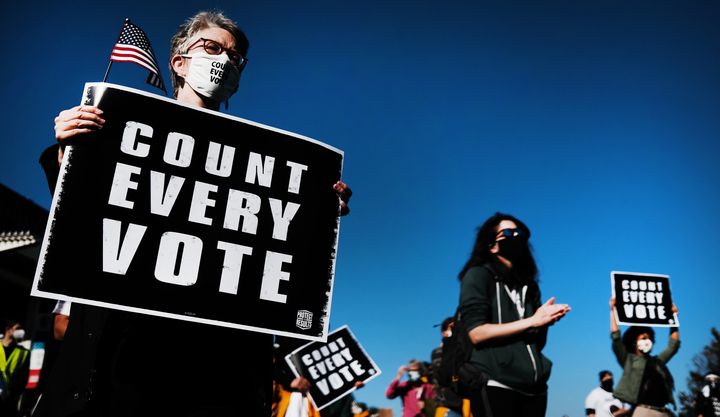 People participate in a protest in support of counting all votes on Nov. 4 in Philadelphia as the election in Pennsylvania is
